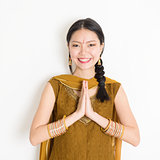 Mixed race young Indian woman greeting