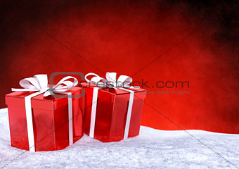 Christmas gifts in snow on red background. 3D render.