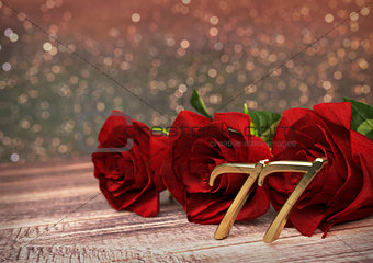 birthday concept with red roses on wooden desk. seventy-seventh. 77th. 3D render