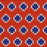 Knitting seamless pattern in blue, white and orange colors