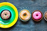 Colorful Donuts breakfast composition with different color styles