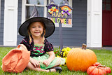 Portrait Of Girl Dressed In Trick Or Treating Witch Costume