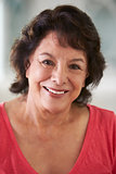 Head And Shoulders Portrait Of Senior Hispanic Woman At Home