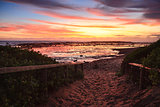 Sandy path to the beach at dawn sunrise