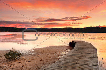 Vibrant skies and curved jetty