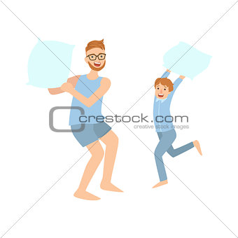 Dad And Son Pillow Fighting In Pajamas