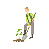 Guy Digging The Soil Around Plant