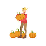 Farmer With Pupmpkins Holding One In Hands