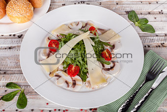 Arugula salad with mushrooms and cheese
