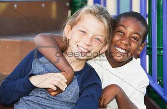 Happy young friends sitting together
