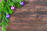 Christmas fir tree with decoration on wooden background