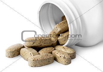 Open plastic bottle and heap of vitamins