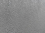 Close-up of silver blistered paint texture.