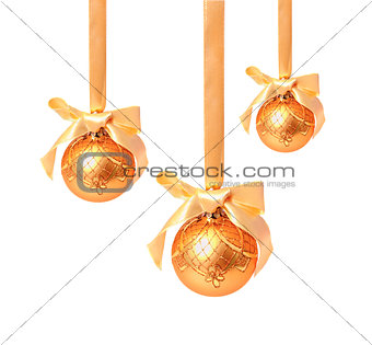 Hunging golden christmas balls isolated on a white