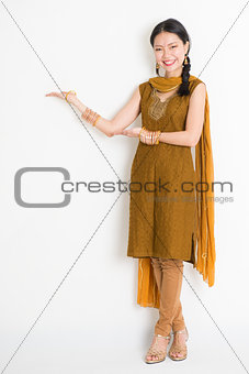 Indian Chinese woman hands showing something