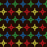 Seamless knitting pattern with color crosses over dark brown
