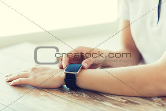 close up of hands setting smart watch