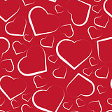 Seamless pattern with white hearts on red