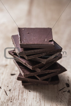 Stack of Chocolate Bars on Wooden Surface