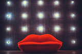 Beautiful luxury red lips sofa on grey background with lights