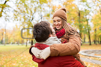 happy young couple meeting in autumn park