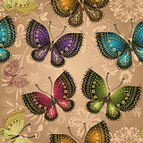 Seamless beige pattern with bright colorful butterflies