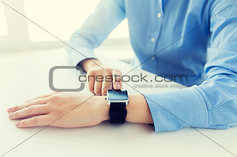 close up of hands setting smart watch