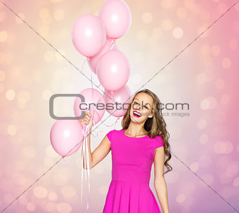 happy young woman or teen girl with balloons