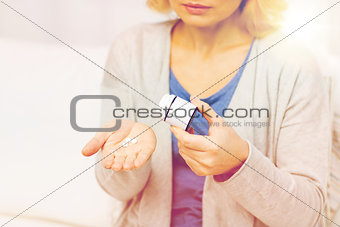 close up of woman with medicine at home