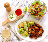 Chicken wings with salad