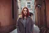 Pretty young woman in a coat 