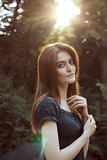 Lovely brunette woman in a rays of sun