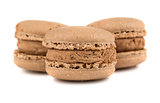 Three brown french macaroons