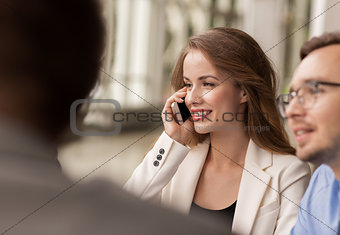 businesswoman calling on smartphone at office