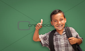 Cute Hispanic Boy In Front of Blank Chalk Board