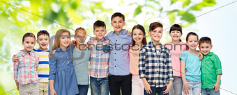 group of happy smiling children hugging