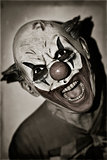 scary evil clown in sepia toning