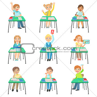 Children Sitting At School Desks In Class