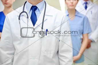 close up of medics or doctors at hospital