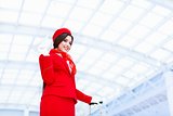 Smiling stewardess in a form
