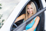 Young woman behind the steering wheel