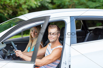 Young people enjoying a roadtrip in the car