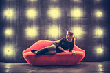 Beautiful luxury fashionable sexy woman on red lips sofa  the lights backgound