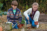 Boy and Girl Children Gardening