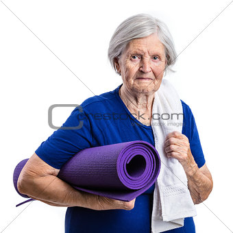 Senior woman holding yoga mat