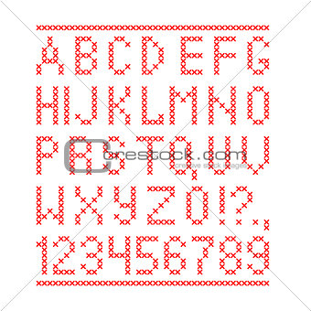 Embroided by cross stitch english alphabet with numbers and symbols isolated on white background.