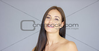 Single gorgeous woman over gray background