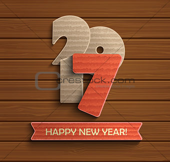 Happy new year 2017 design on wood background.