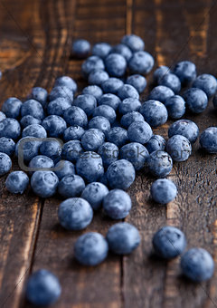 Blueberries on grunge wooden kitchen board