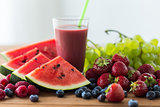 fruit and berry juice or smoothie on wooden  table